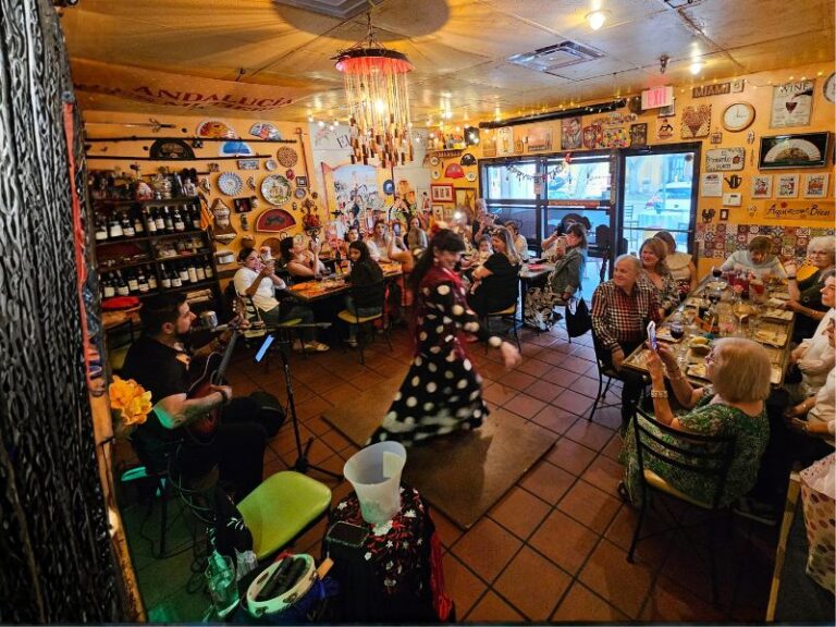 Guests enjoying live music at a cozy Spanish restaurant & tapas in Miami